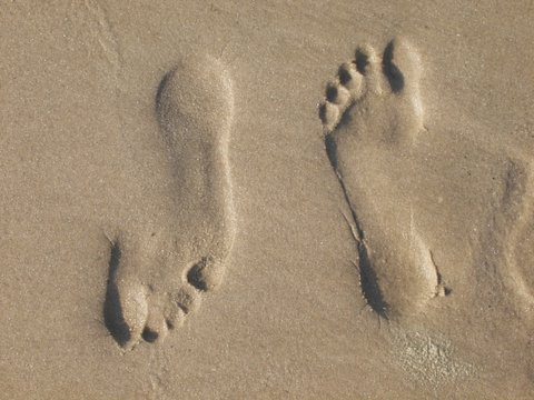 Voeten in het zand
